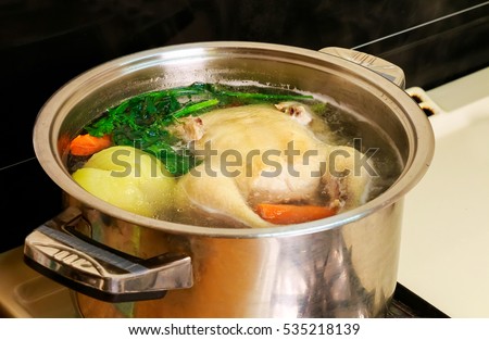 I make chicken broth in a pot chicken broth Royalty-Free Stock Photo #535218139
