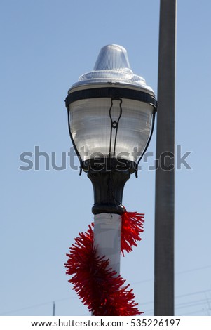Christmas garland wrapped around lamp pole