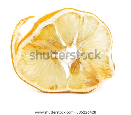Slice of dried lemon isolated on white background.