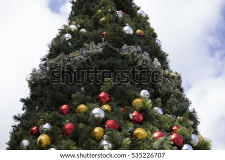 Outdoors Christmas tree with multicolored decorations