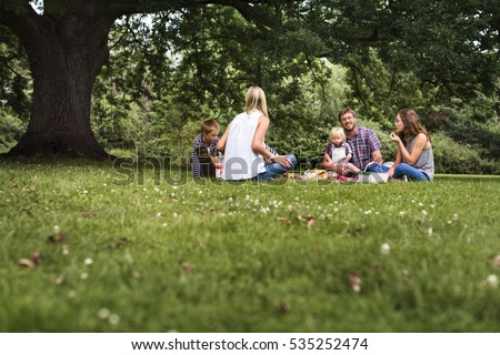Family Generations Picnic Togetherness Relaxation Concept Royalty-Free Stock Photo #535252474