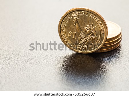 dollar coins stack on black