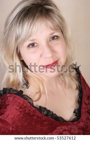 Beautiful blond female against a light background