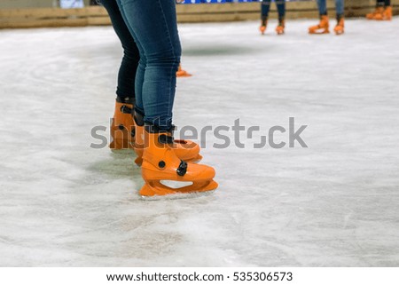 people are skating on the rink