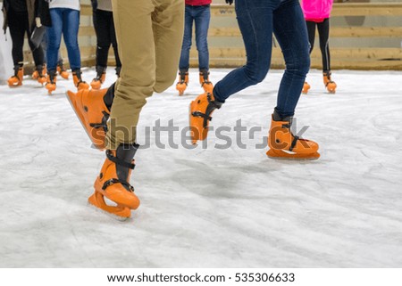 people are skating on the rink