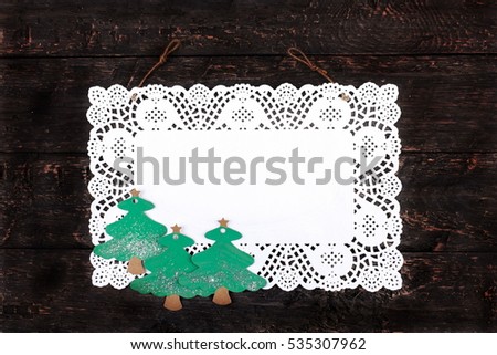 Christmas, pure white napkin, placed on a wooden, vintage look, dark background