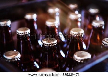 Crate with full beer bottles Royalty-Free Stock Photo #535339471