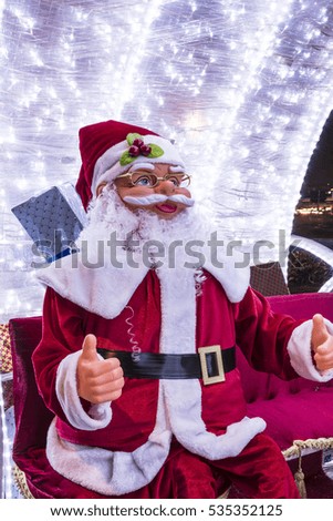 Santa Claus snowmobile and reindeer

