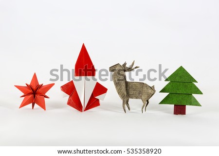 Christmas set. Santa claus, red star, deer and Christmas tree origami, paper craft