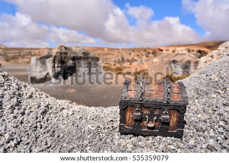 Conceptual Photo Picture of a Treasure Trunk Object in the Dry Desert