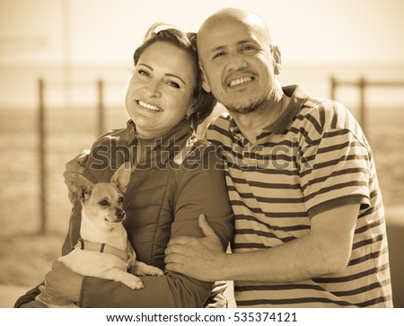 Ã¯Â»Â¿portrait of a man and a woman and chihuahua dog on the beach
