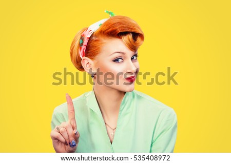woman gesturing a no sign. Closeup portrait unhappy, serious pinup retro style girl raising finger up saying oh no you did not do that yellow background. Negative emotions facial expressions, feelings Royalty-Free Stock Photo #535408972