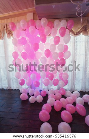Bunch of pink and white balloons in luxurious room