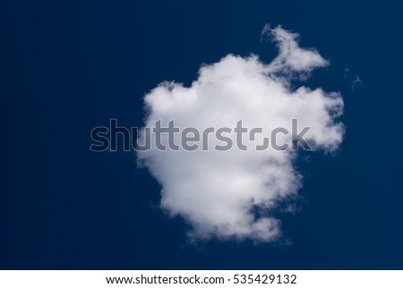 Small cloudlet on dark blue sky. Using a polarizing filter when shooting gave deep blue sky