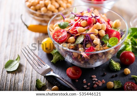 Healthy homemade chickpea and veggies salad, diet, vegetarian, vegan food, vitamin snack Royalty-Free Stock Photo #535446121