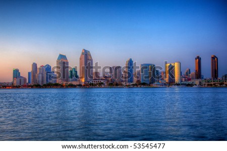 Sun setting lights up the buildings on San Diego seafront in HDR