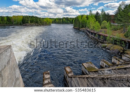 Spillway of hydroelectric power generation plant dam at Oat rapids of Kymijoki main stream in Mankala, Finland. Whitewater height of fall of 8.1 meters and a power plant of 25 MW.