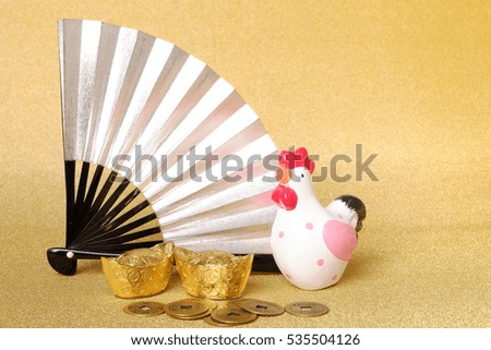 Rooster chinese zodiac 2017 with gold and chinese coins on gold background as New year concept.