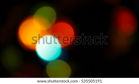 Multicolored soft bokeh on a abstract black background