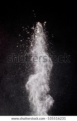 white powder splatted background,Freeze motion of white powder exploding.