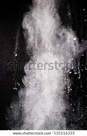 white powder splatted background,Freeze motion of white powder exploding.