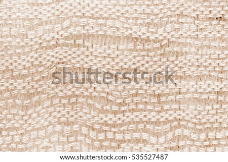 Brown hand weaving matting tweed fabric texture. Closeup horizontal fragment 