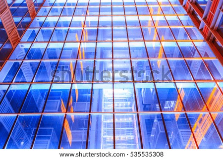 Modern skyscrapers glass wall in the evening