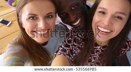 Group of people doing selfie during lunch