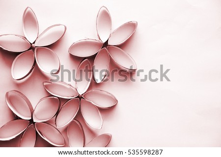 Pretty flowers made out of cardboard on white background