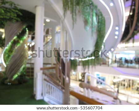 Spiral staircase, abstract blur beautiful luxury shopping mall and retail store interior for background