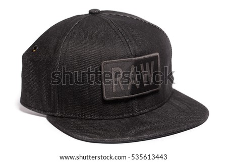 Fitted black hat with a RAW text isolated on a white background.