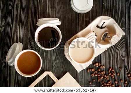coffee cup take away at wooden background top view