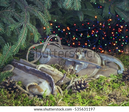 Christmas arrangement with old skates under the Christmas tree