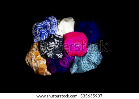 colorful Turkish Oriental beautiful scarves with pictures of natural silk on a black background