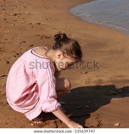 Kid and sea sand