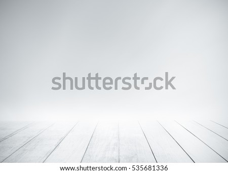 White wood floor with surfing wave background. Blue cool water and sky bright rays light. Nature wallpaper blur of sea daytime. Focus to wooden in the foreground. Timber pattern texture stage.