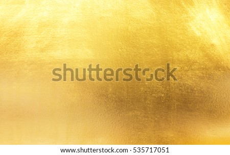 Shiny yellow leaf gold foil texture background Royalty-Free Stock Photo #535717051