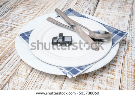 white plate with car  on wood vintage background
