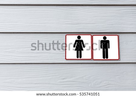 Toilet label on wooden wall