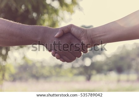 Business partnership meeting concept. Image handshake. Successful businessmen handshaking after good deal. Horizontal, blurred background Royalty-Free Stock Photo #535789042