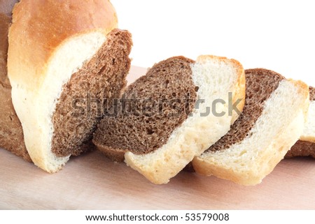 the loaf of bread is cut into pieces