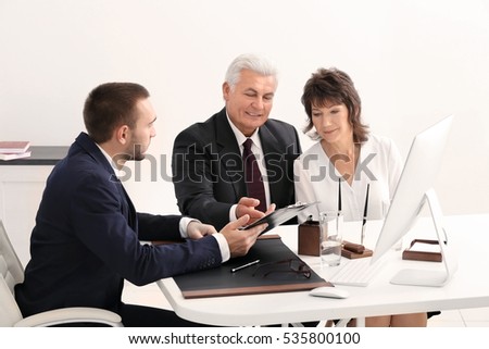 Senior couple at notary office