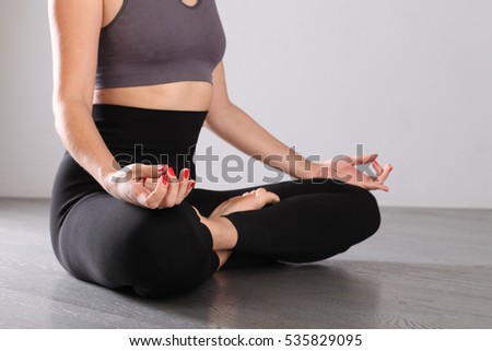 A woman practices yoga. 