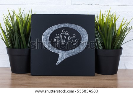 Thinking bubble with family on blackboard background