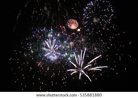Firework display light up the sky with dazzling display celebration  New years eve congratulations event. stock, photo, photograph, picture, image