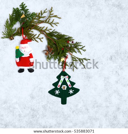 Christmas decorations Santa Claus and Christmas tree on snowy background
