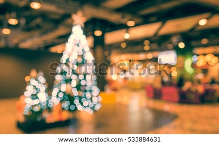 abstract blur image of shopping mall  on christmas time for background .(vintage tone)