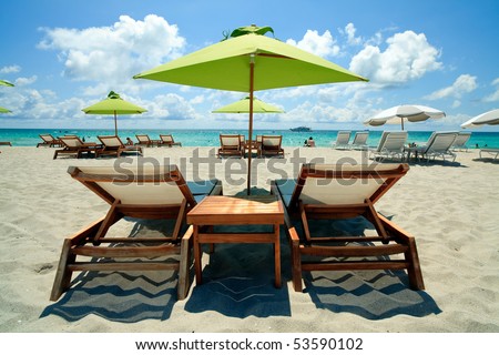 South Beach Lounge Chairs and Umbrellas Royalty-Free Stock Photo #53590102