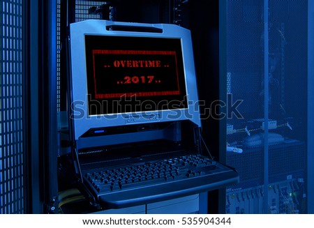 " Overtime 2017 " in red fiber frame on monitor display in server room data center