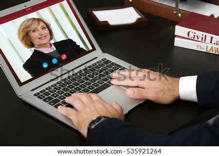 Woman video conferencing with lawyer on laptop. Video call and online service concept.